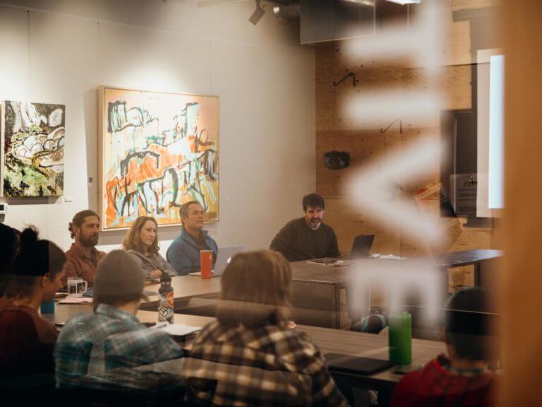 people seated in a conference room in Ruffwear shared space